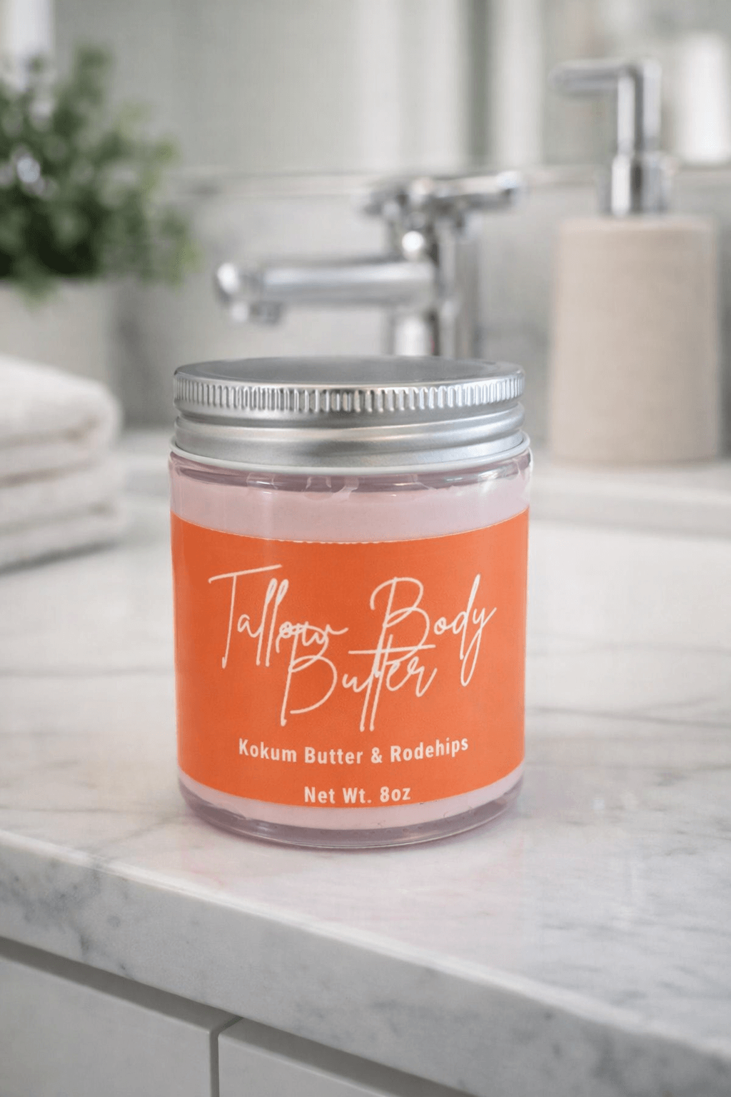 Tallow Body Butter in a glass jar with orange label, featuring Kokum Butter & Rosehips for nurturing skin.